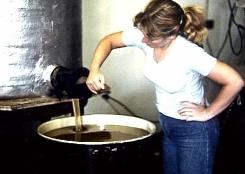 Filling a barrel with honey